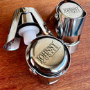 Stopper Hermético para Espumantes Johnny Cooker em aço inox polido, vedação interna em silicone com dupla trava de segurança que se adapta a garrafas de espumantes em geral
